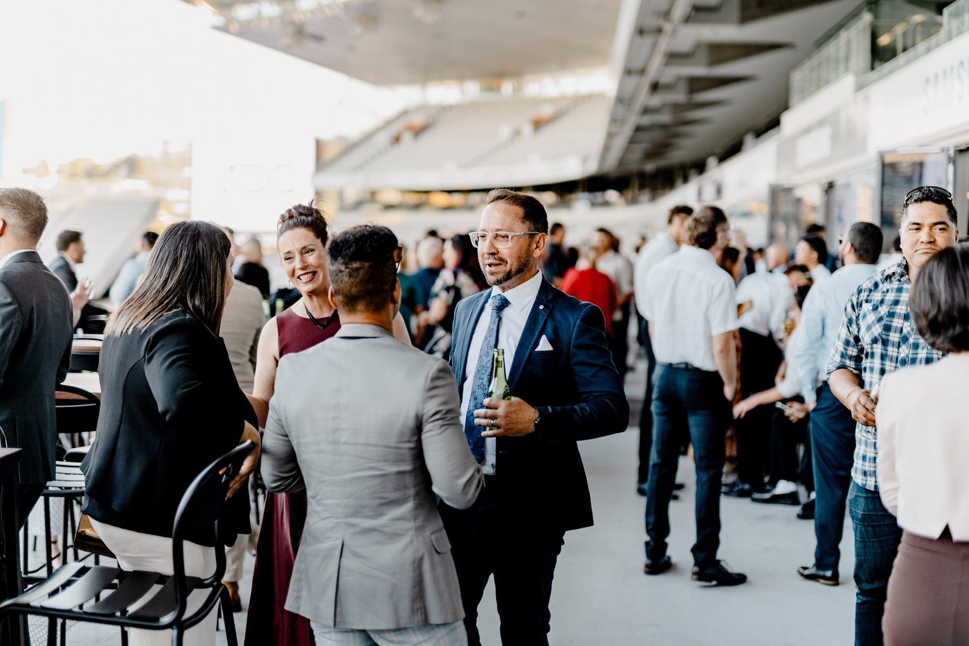 Guests connecting over drinks at a BRAVA-managed corporate event